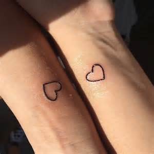 matching tattoos hearts